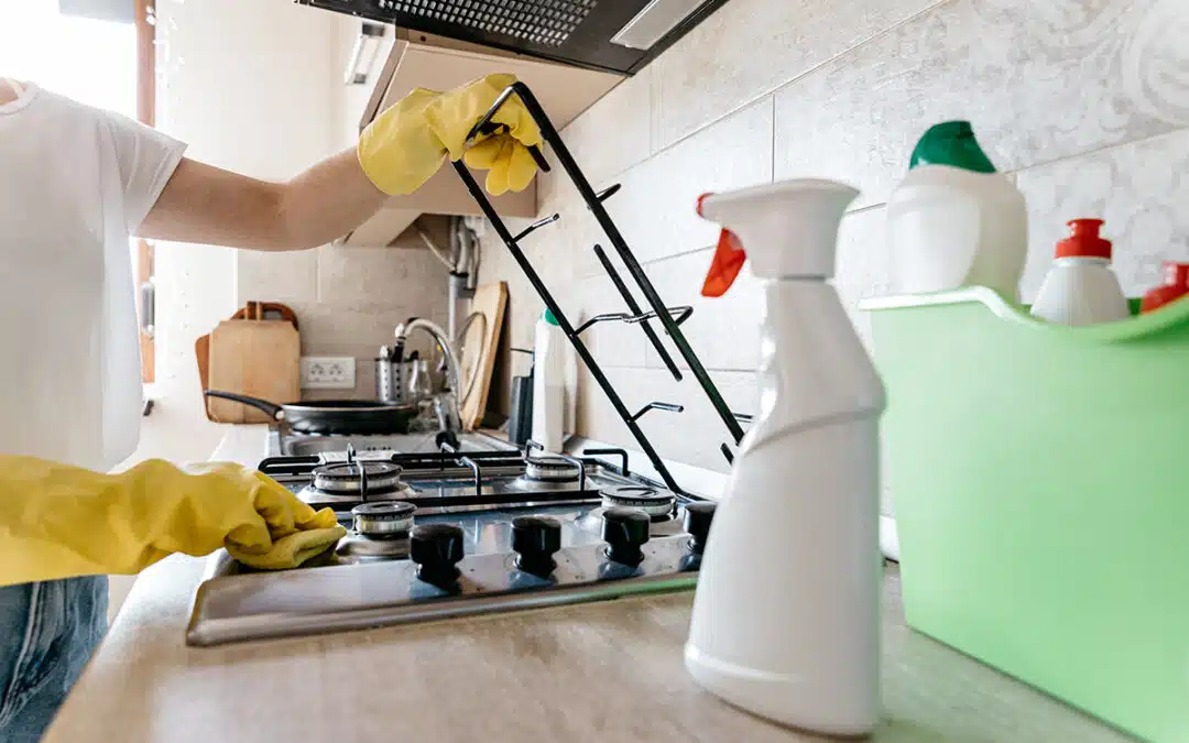 woman-cleaning-the-kitchen-of-her-apartment